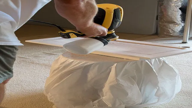 how to use a paint sprayer on cabinets